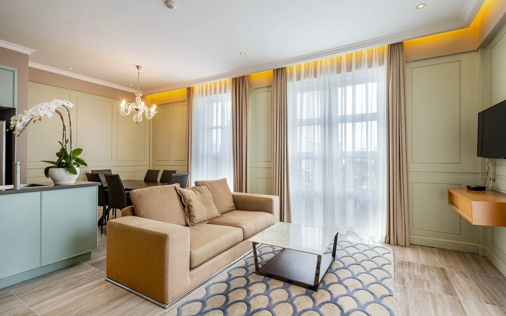 Living and dining space in a serviced apartment at Lafayette De Saigon