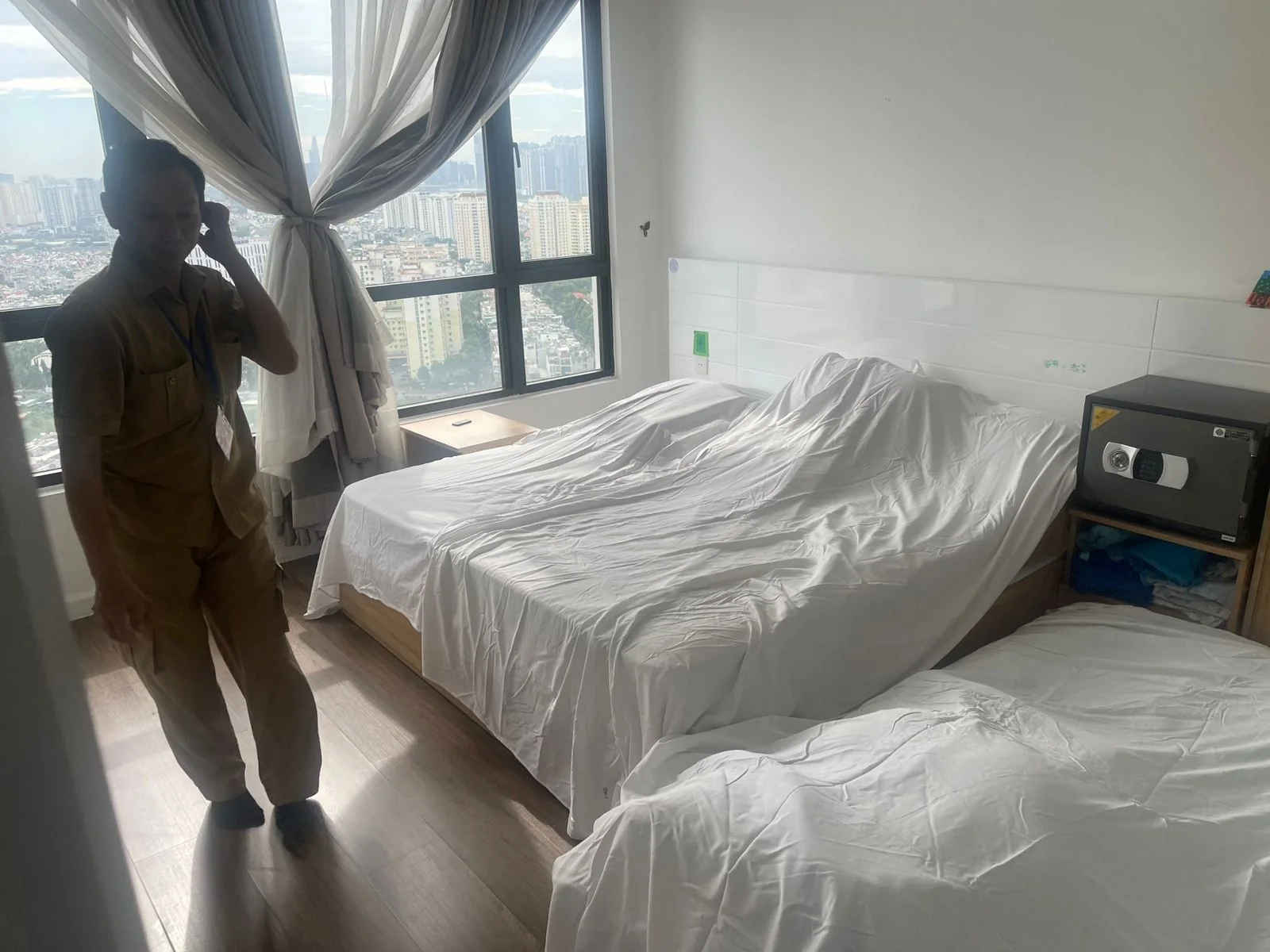 Occupied apartment carefully protected before maintenance work