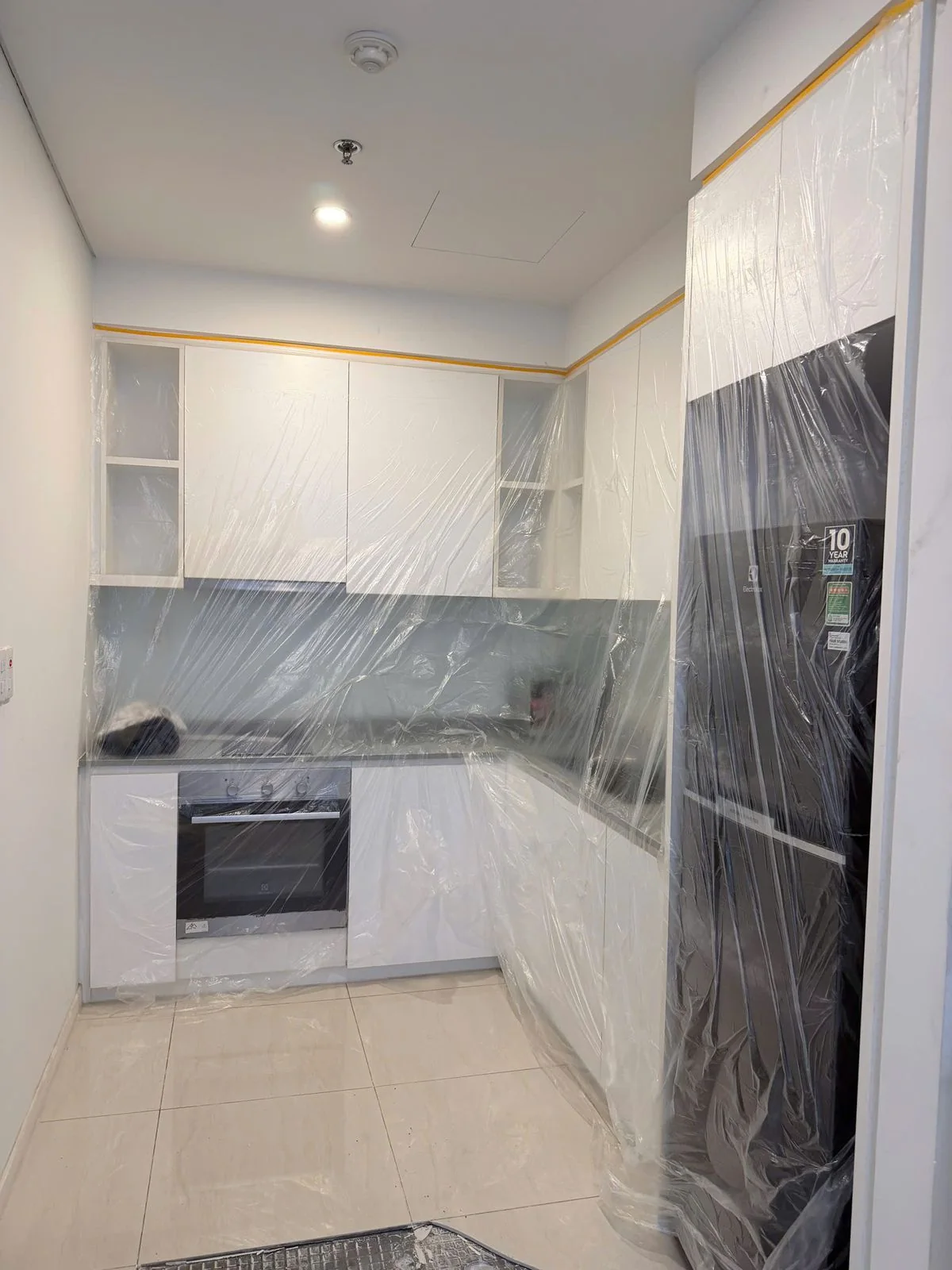 Apartment kitchen protected before maintenance work begins
