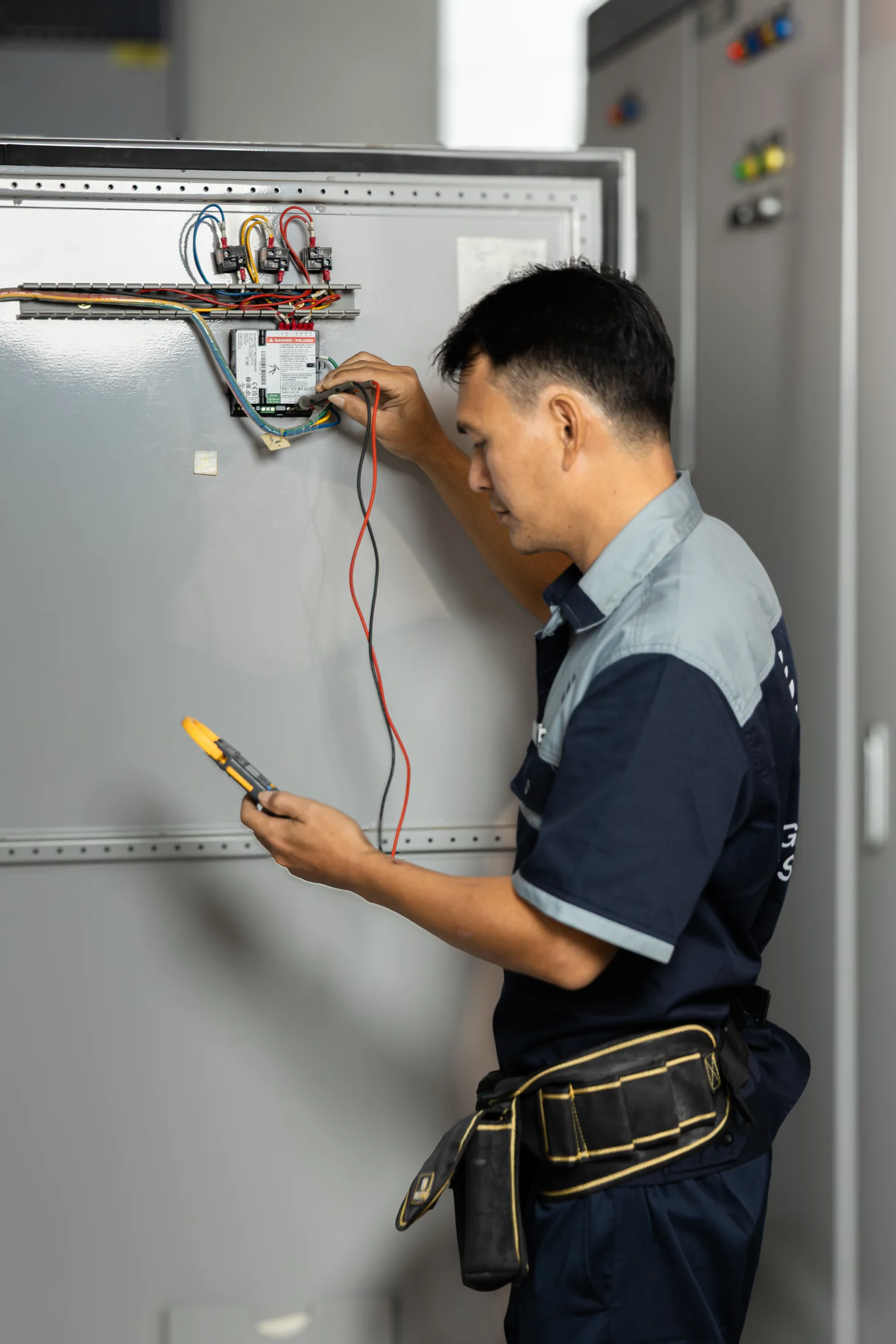 Legacy Asset technical team member inspecting building equipment